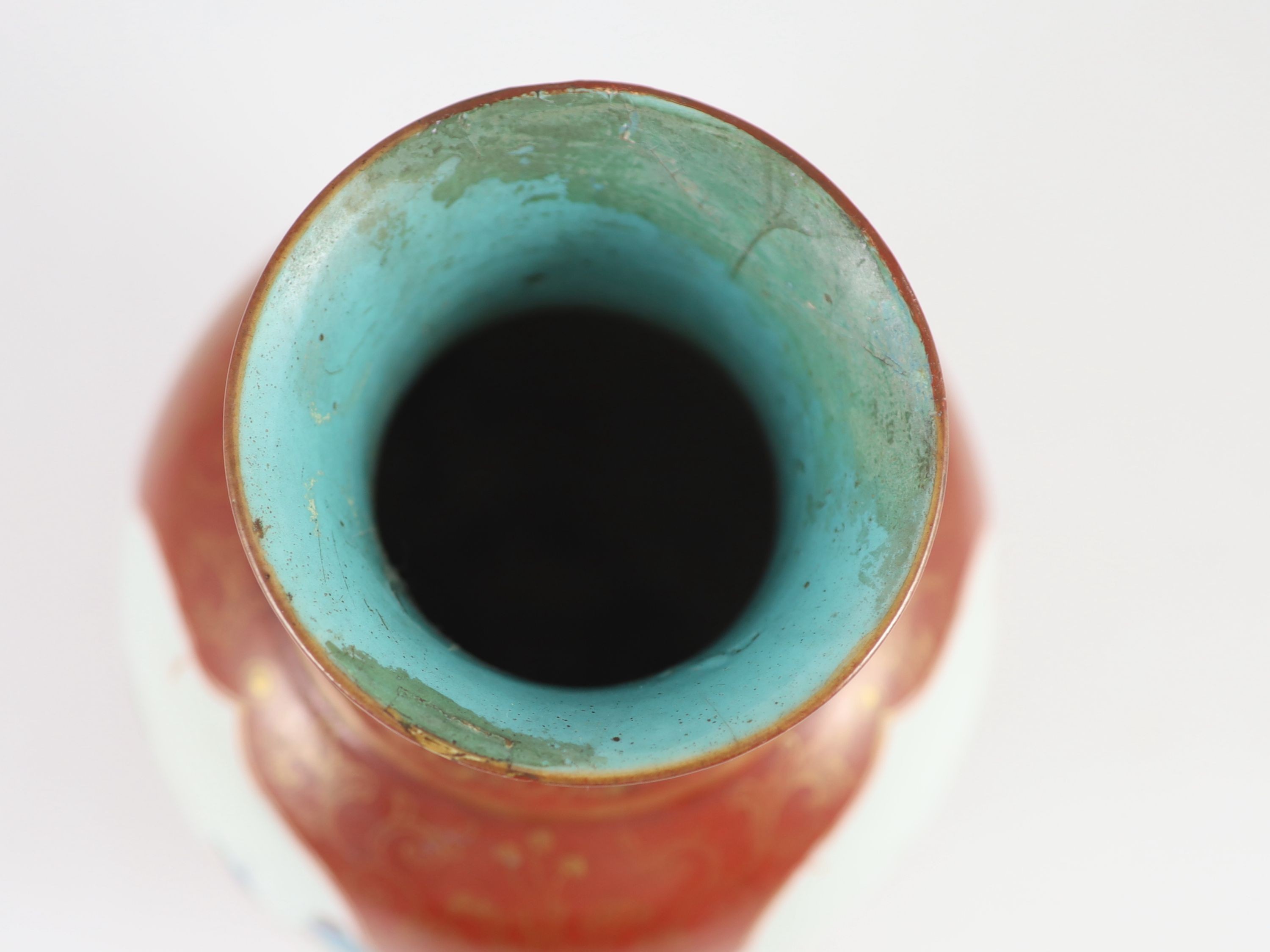 A Chinese coral ground ‘foreigners’ vase, Qianlong/Jiaqing period, 23 cm high, discoloured restoration to neck